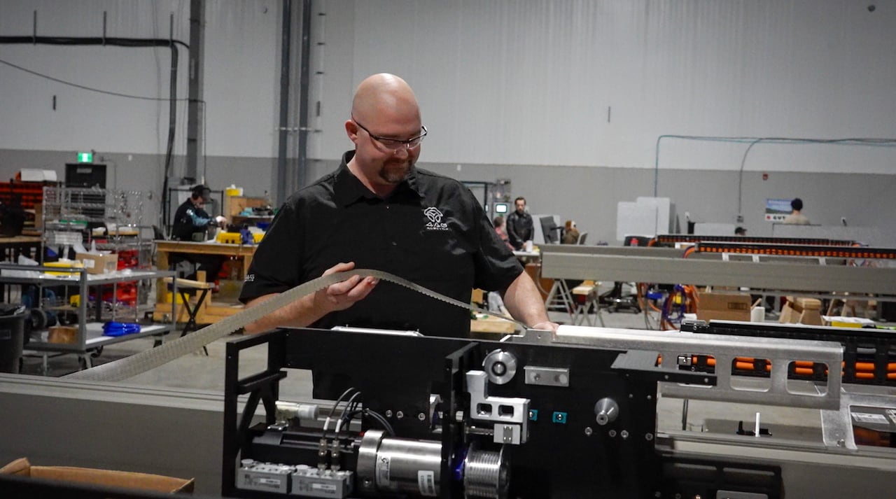 Man standing near machinery 