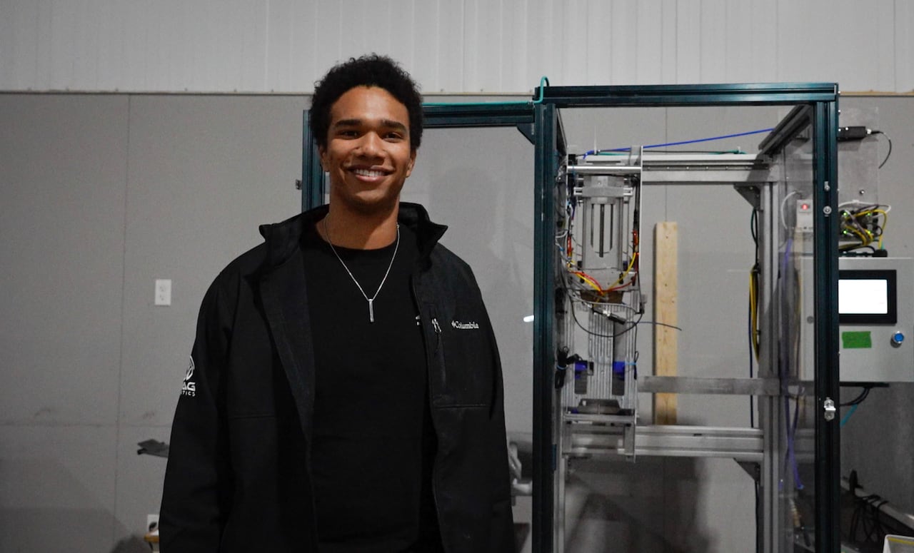 Man standing in front of a machine 