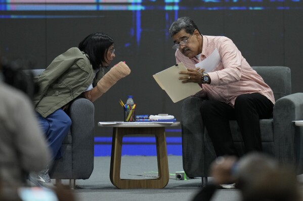 Venezuelan President Nicolas Maduro, right, talks with Vice President Delcy Rodriguez during a meeting with international observers in Caracas, Venezuela, July 27, 2024. (AP Photo/Matias Delacroix, File)