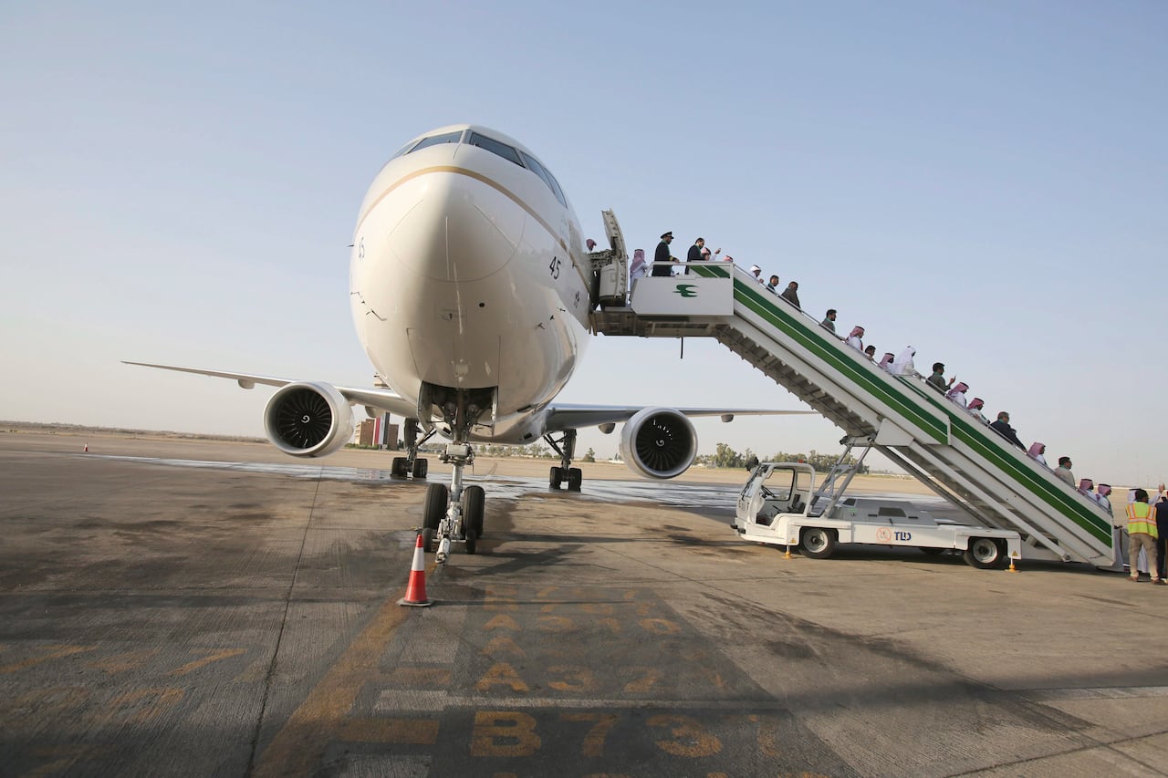 Passengers arrive on Saudia airline to Baghdad International Airport, Iraq, Thursday, Oct. 19, 2017. Saudi Arabia's national carrier, Saudia, launched  its inaugural flight to Baghdad.