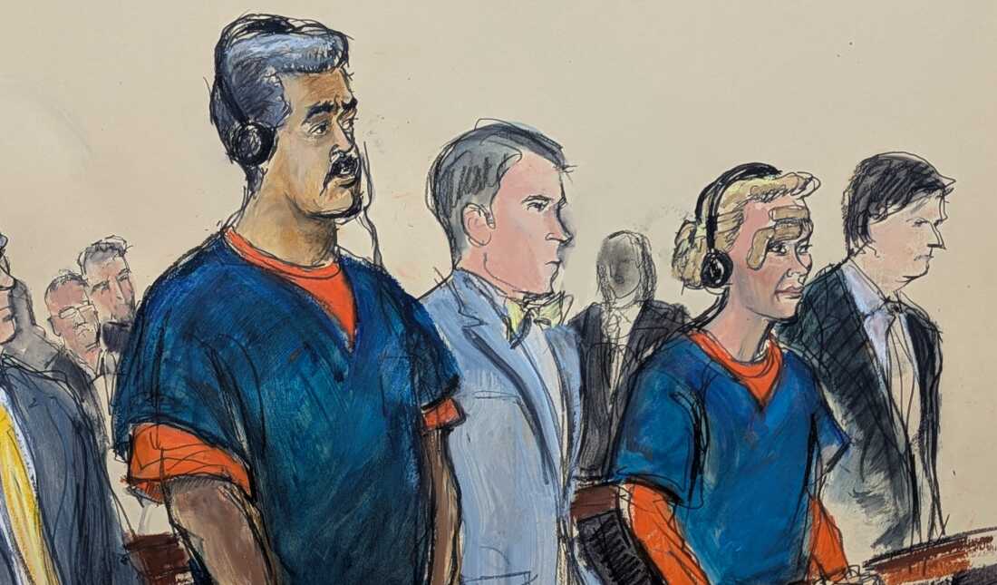 This courtroom sketch shows ousted Venezuelan President Nicolás Maduro on the left side of the sketch and his wife, Cilia Flores, on the right side. They are wearing blue shirts on top of orange shirts as they stand in a federal court in Manhattan, New York. Two men wearing suits, who are their lawyers, stand next to them.