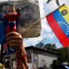 A government supporter holds an action figure of Super Bigote during a protest demanding the release of President Nicolas Maduro, who was captired by U.S. forces, in Caracas, Venezuela, Sunday, Jan. 4.