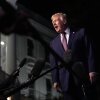 President Donald Trump talks to the media as he walks to Marine One from the White House, Friday, Dec. 19, 2025, in Washington.