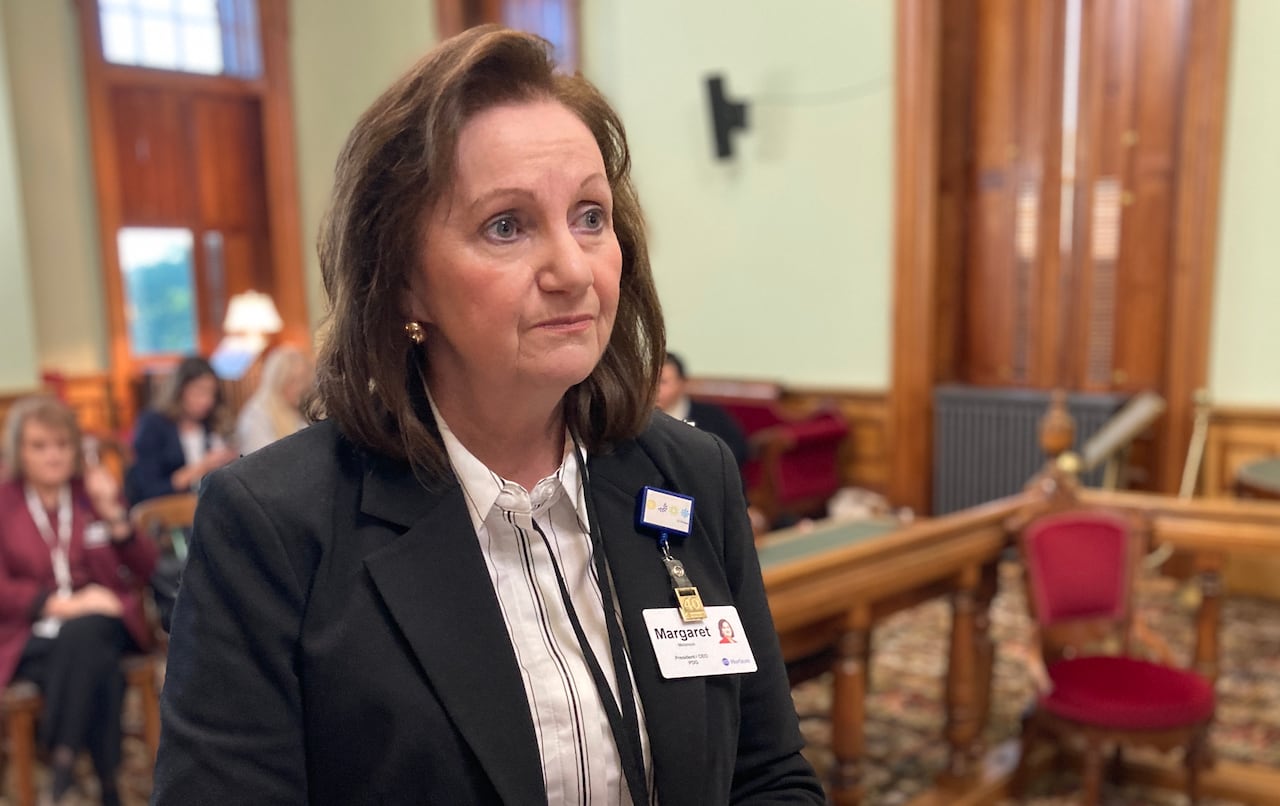 A woman poses for a photo