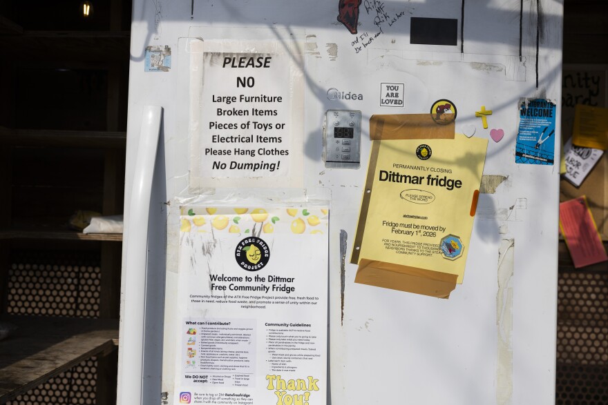 Notices with instructions to leaving food at a free fridge are taped to the outside of the fridge.