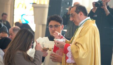 Praying at the Jordan River for peace in the Holy Land
