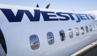 A WestJet plane waits at a gate at Calgary International Airport in Calgary, Alta., Wednesday, Aug. 31, 2022. THE CANADIAN PRESS/Jeff McIntosh