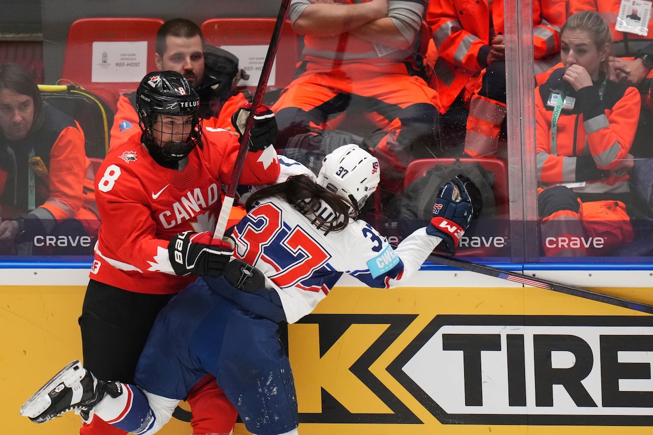 Two hockey players collide.