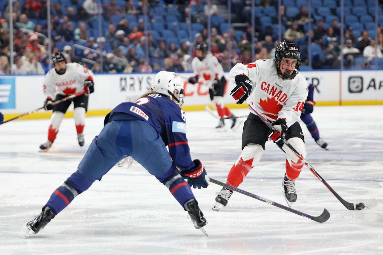 Two hockey players compete.