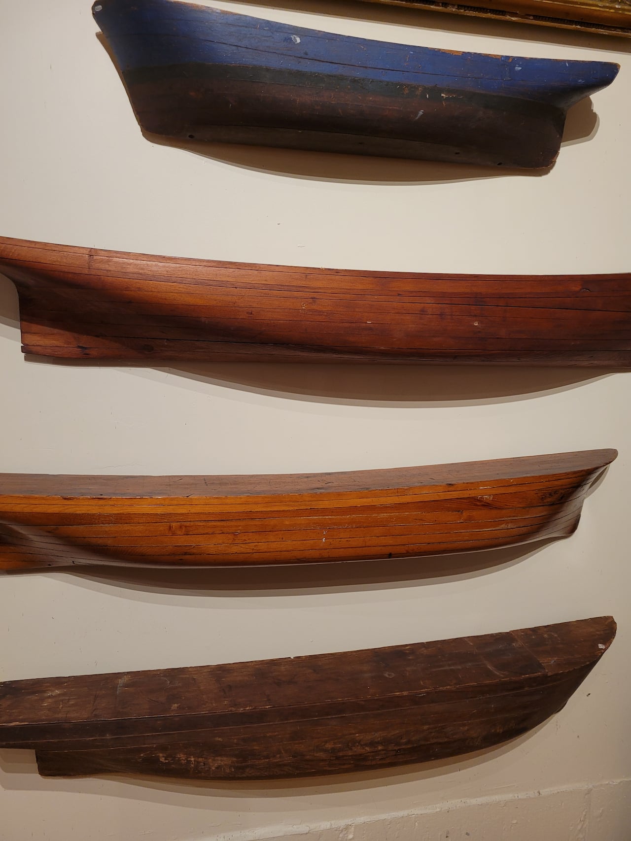 Wooden models of half a ship hull