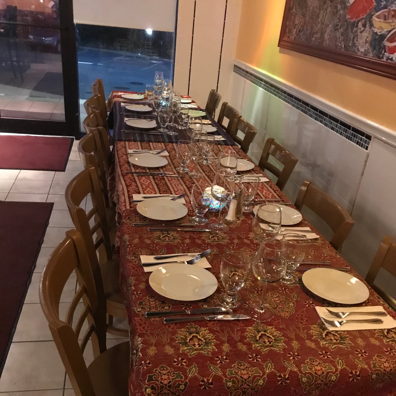 A long table and 12 chairs in a restaurant