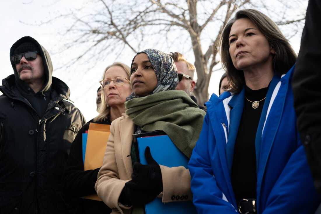 U.S. Rep. Ilhan Omar, joined by Rep. Kelly Morrison (L) and Rep. Angie Craig (R) arrive outside of the regional ICE headquarters at the Whipple Federal Building on Saturday in Minneapolis. The Democratic congresswomen were granted access to the facility initially, but were quickly asked to leave by officials there.