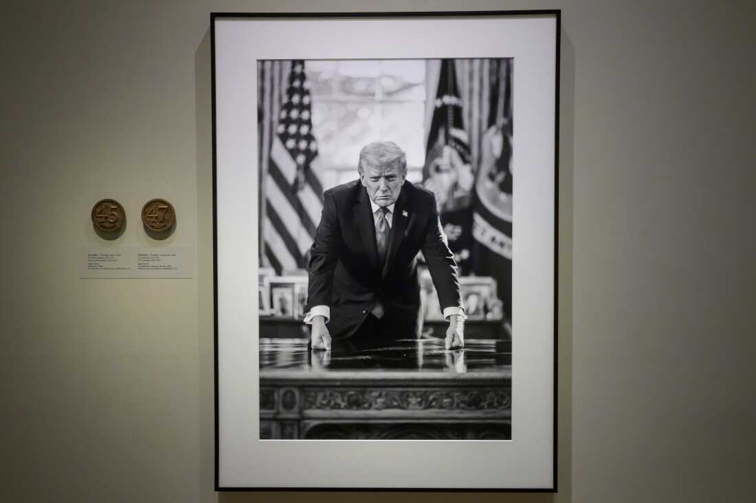 A photograph of President Trump and a short plaque next to it are on display at the Smithsonian's National Portrait Gallery's "American Presidents" exhibit on Sunday.