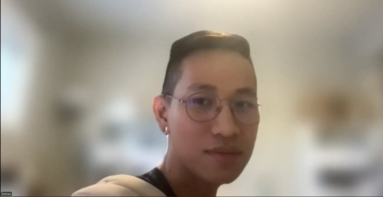 a young man in glasses on a zoom interview