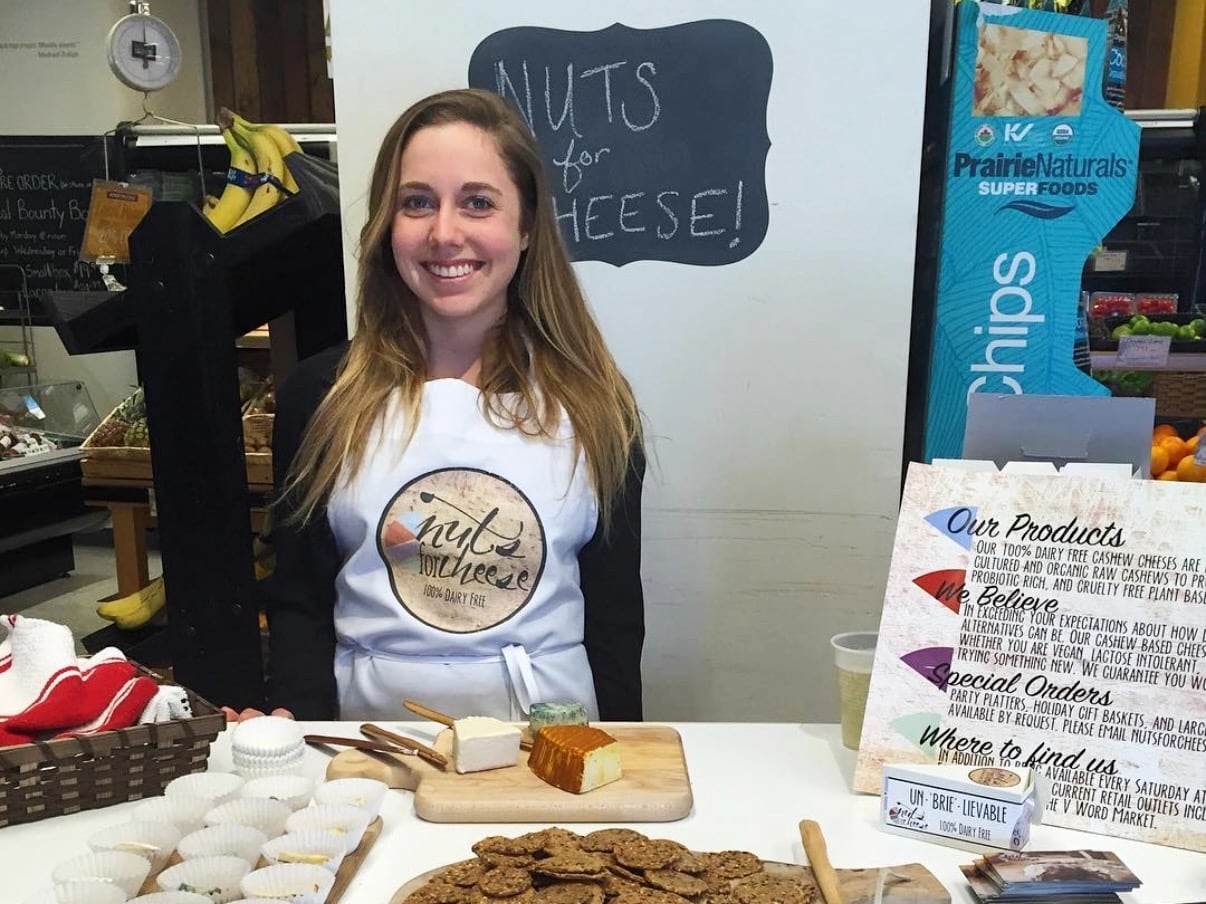 Margaret Coons in front of a sample of vegan cheese and crackers