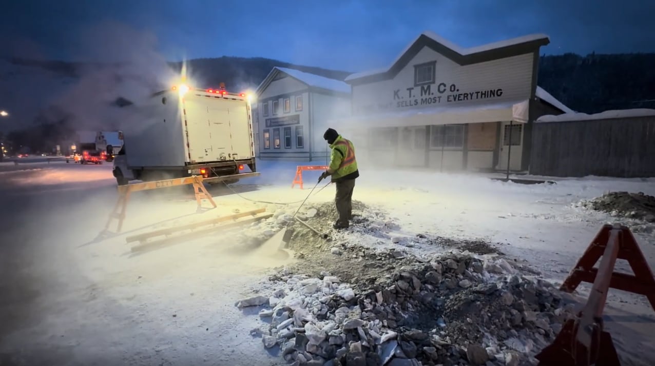 A person using equipment on a street