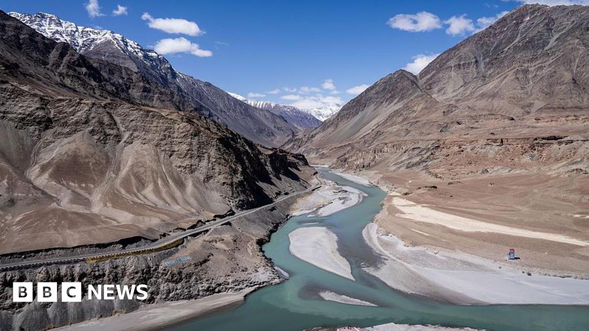 A general view of a river running through the area with the Himalaya Mountains in the background in Leh, one of the most remote areas of the Indian-administered portion of the Kashmir region, on April 13, 2025.