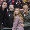 Wrexham co-owners Ryan Reynolds (from right), his wife Blake Lively and Rob McElhenney pose with fans before the English League One soccer match between Wrexham and Charlton Athletic at the Racecourse ground in Wrexham, Wales, on April 26, 2025.