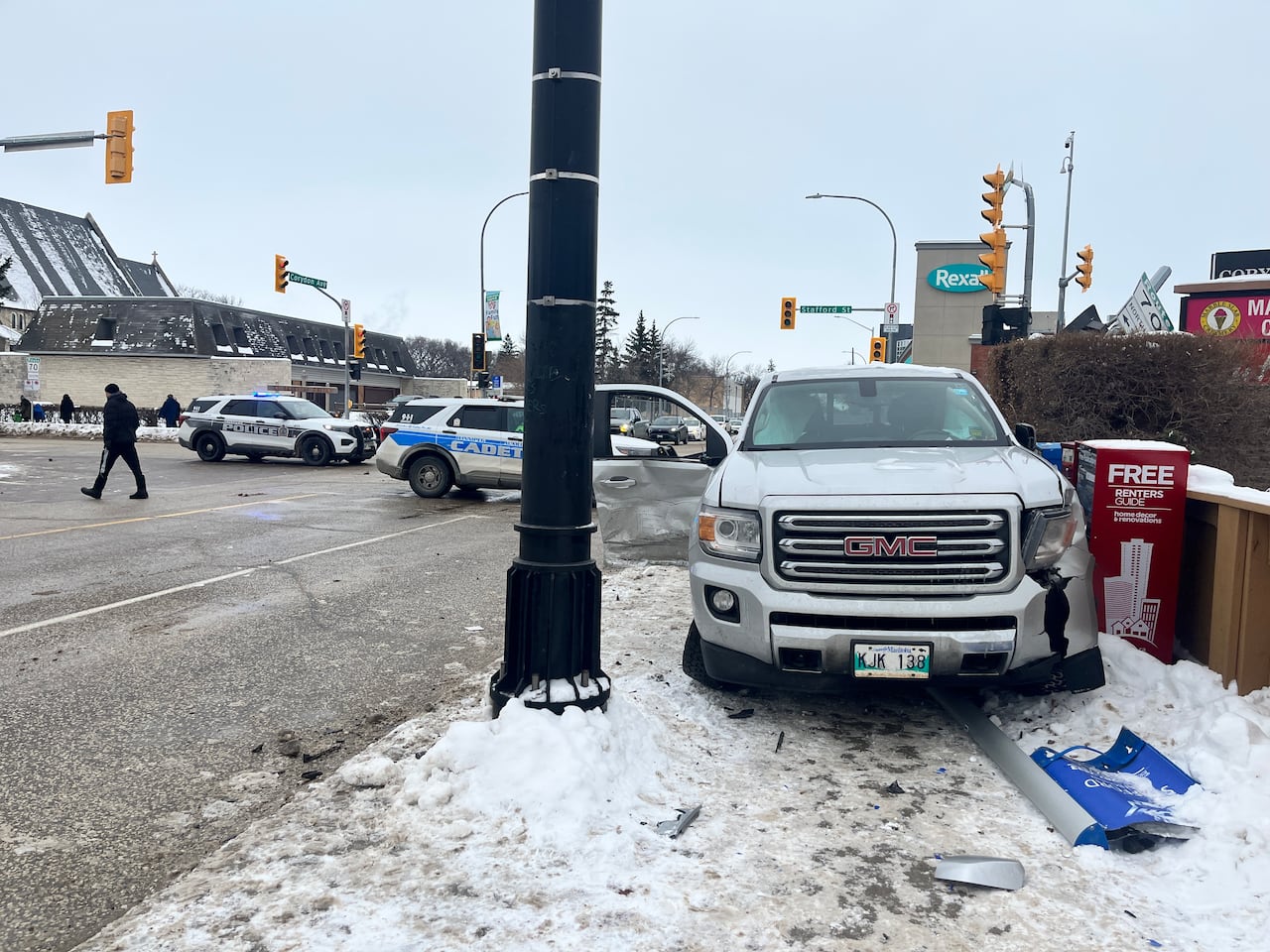 Officers direct traffic after a collision.