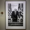 A photograph of President Trump and a short plaque next to it are on display at the Smithsonian's National Portrait Gallery's "American Presidents" exhibit on Sunday.