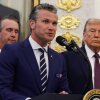 U.S. Defense Secretary Pete Hegseth speaks as President Trump looks on in the Oval Office at the White House on Sept. 2., 2025 in Washington, D.C.