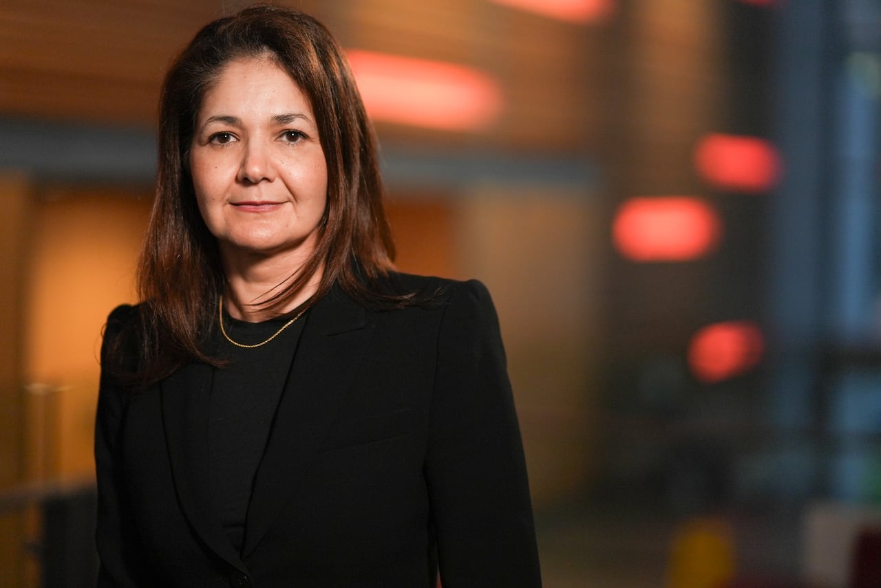 A woman in a blazer.