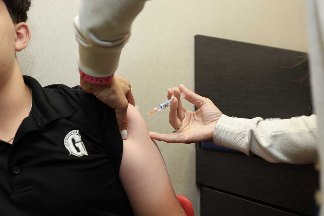 A child receives an immunization at a Florida pediatrician's office in Sept. 2025.