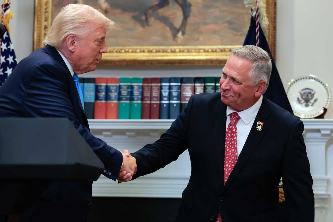 The U.S. Supreme Court has ruled that Illinois Republican U.S. Rep. Mike Bost — seen here with President Trump — has the legal standing to challenge a state law about mail ballots.