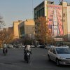 Vehicles in Tehran drive past banners hanging from buildings with anti-U.S. and anti-Israel messages and portraits of Iranian armed forces commanders and nuclear scientists who were killed in Israeli strikes.
