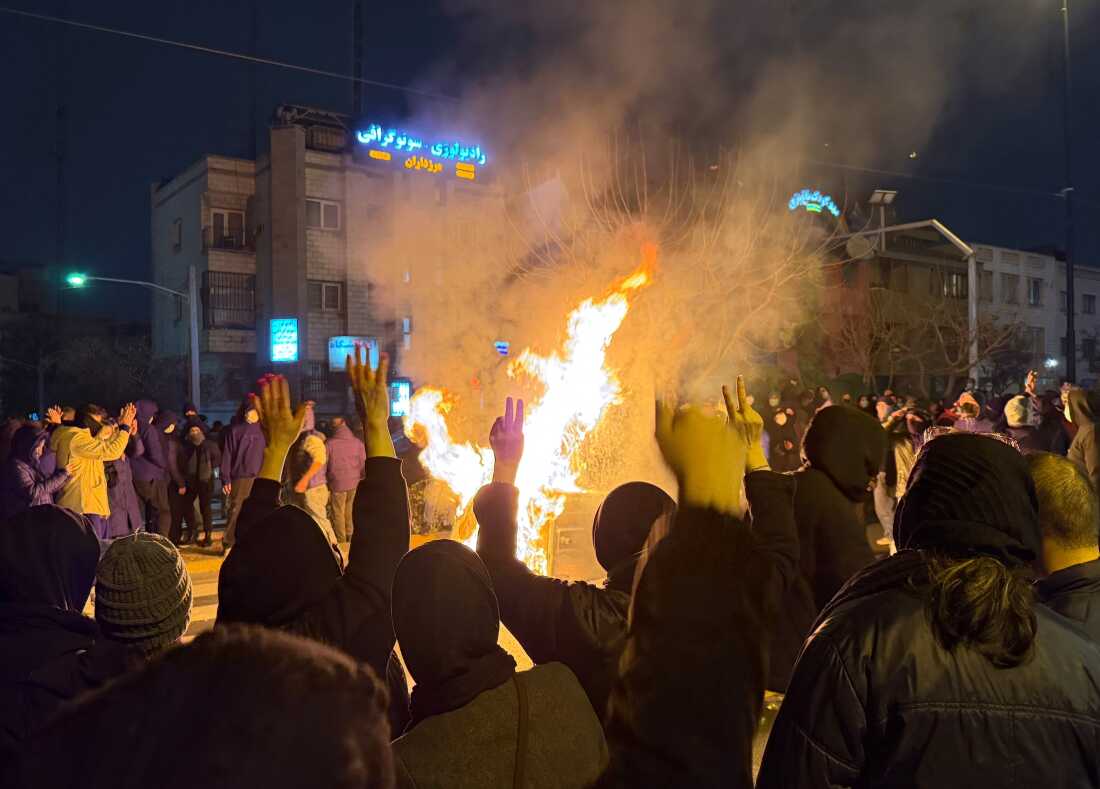 In this photo obtained by The Associated Press, Iranians attend an anti-government protest in Tehran, Iran, Jan. 9.