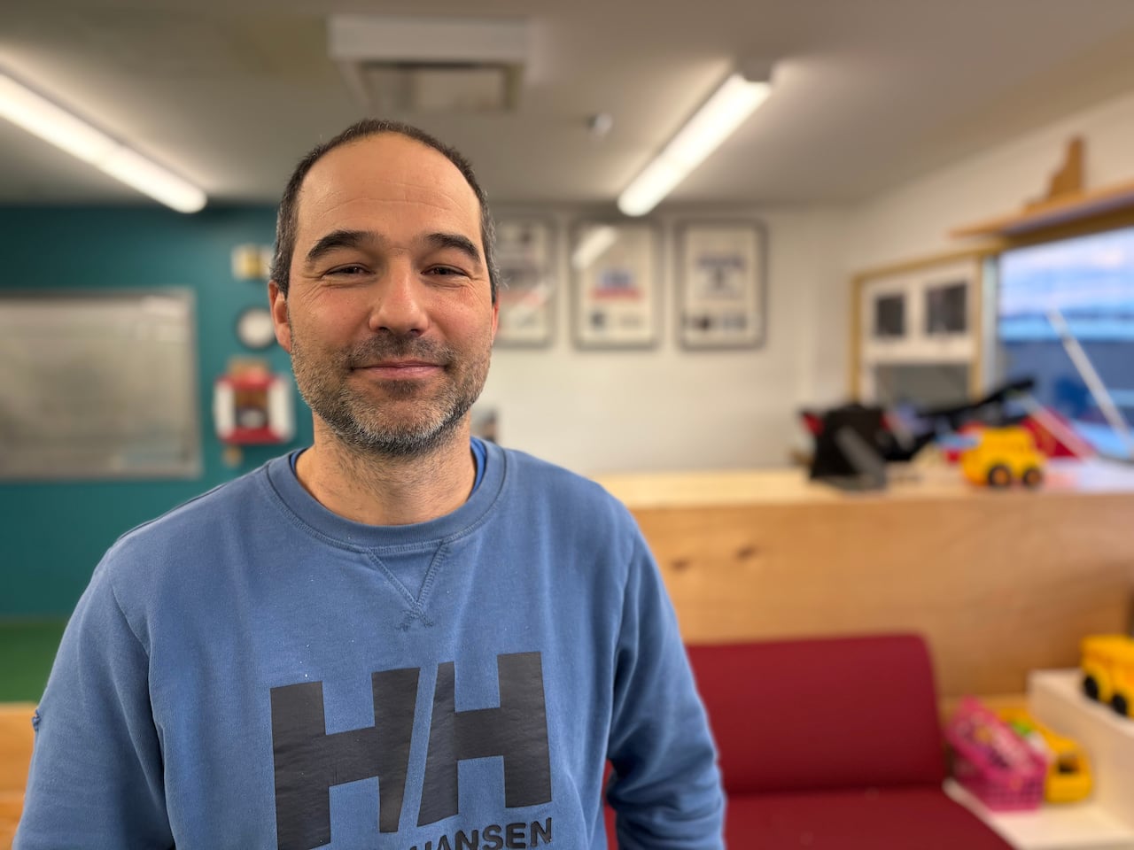 A guy in a blue sweater.