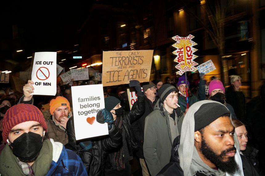 People march during a demonstration against increased immigration enforcement, days after the fatal shooting of Renee Nicole Good by an ICE agent in Minneapolis.