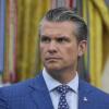 Defense Secretary Pete Hegseth is pictured with a serious facial expression while listening during an event with President Donald Trump to sign executive orders regarding nuclear energy in the Oval Office of the White House, Friday, May 23, 2025, in Washington. Only Hegseth is pictured. He's wearing a blue suit and dark-patterned tie.