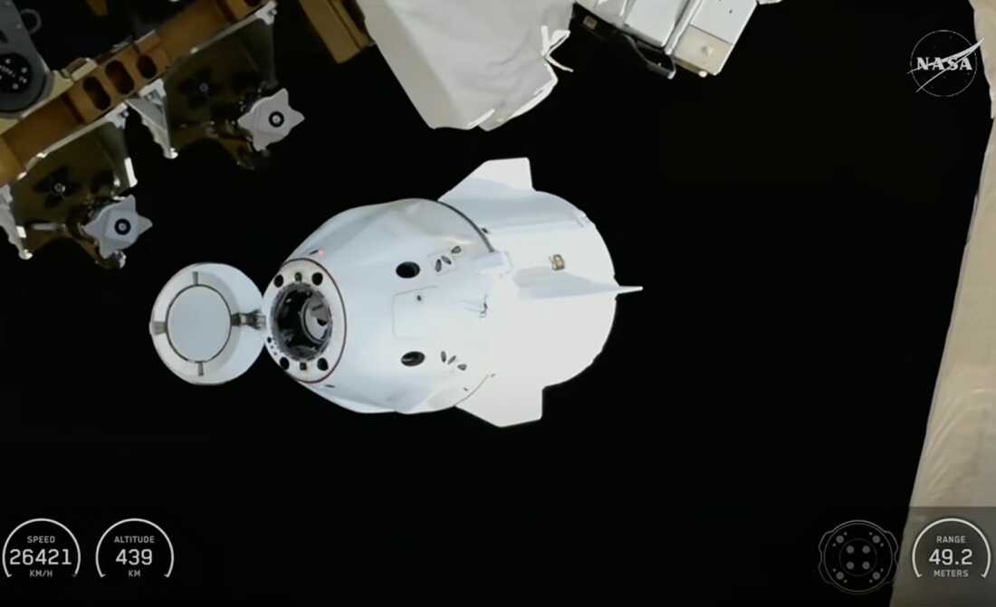 This screengrab from video provided by NASA TV shows the SpaceX Dragon capsule departing from the International Space Station shortly after undocking with four NASA Crew-11 members inside on Wednesday, Jan. 14, 2026.