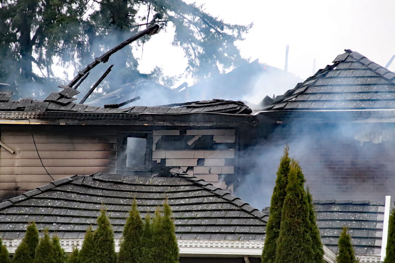 A home in Surrey is badly damaged after a house fire broke out.