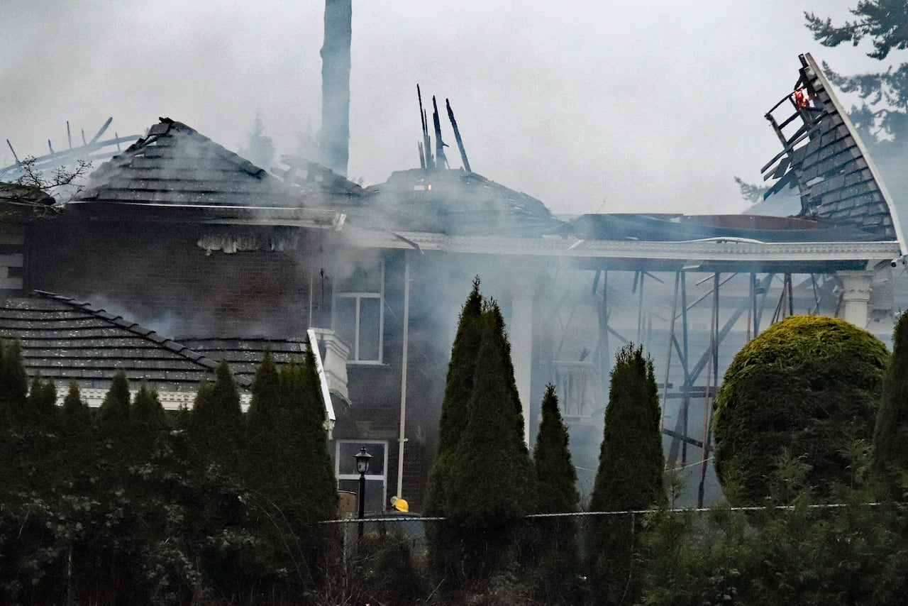 A home in Surrey is badly damaged after a house fire broke out.