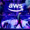 Attendees walk through an expo hall at a conference hosted by Amazon Web Services at The Venetian in Las Vegas on November 28, 2023.