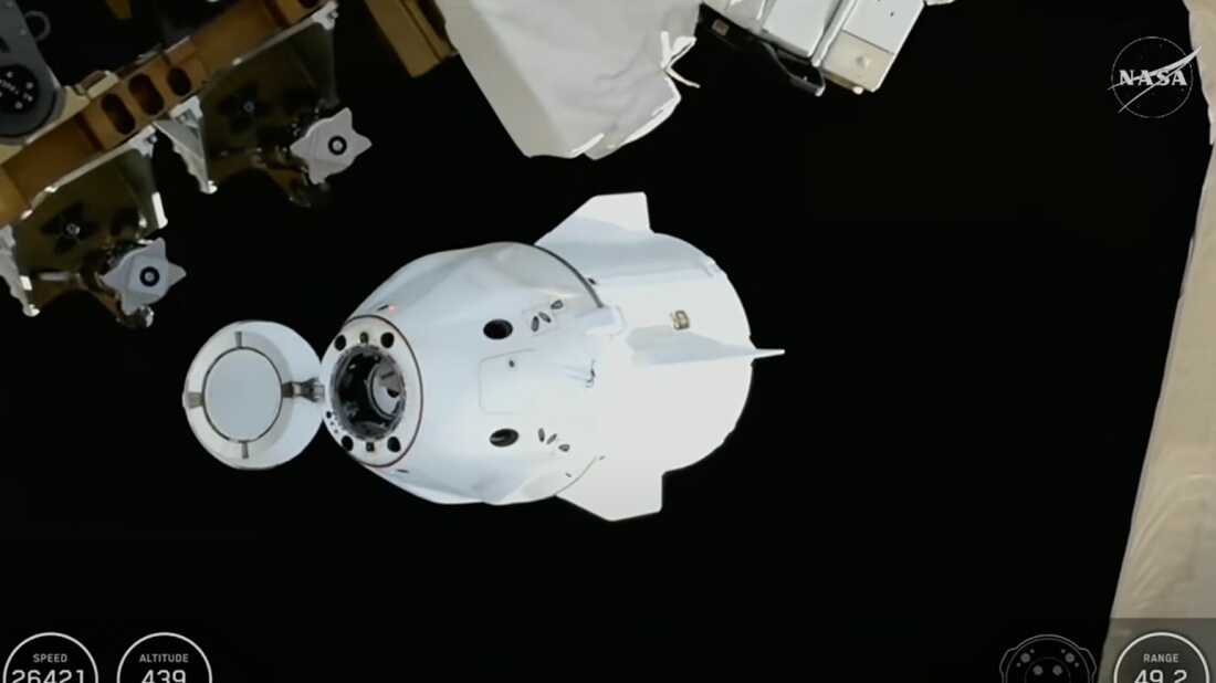 This screengrab from video provided by NASA TV shows the SpaceX Dragon capsule departing from the International Space Station shortly after undocking with four NASA Crew-11 members inside on Wednesday, Jan. 14, 2026.