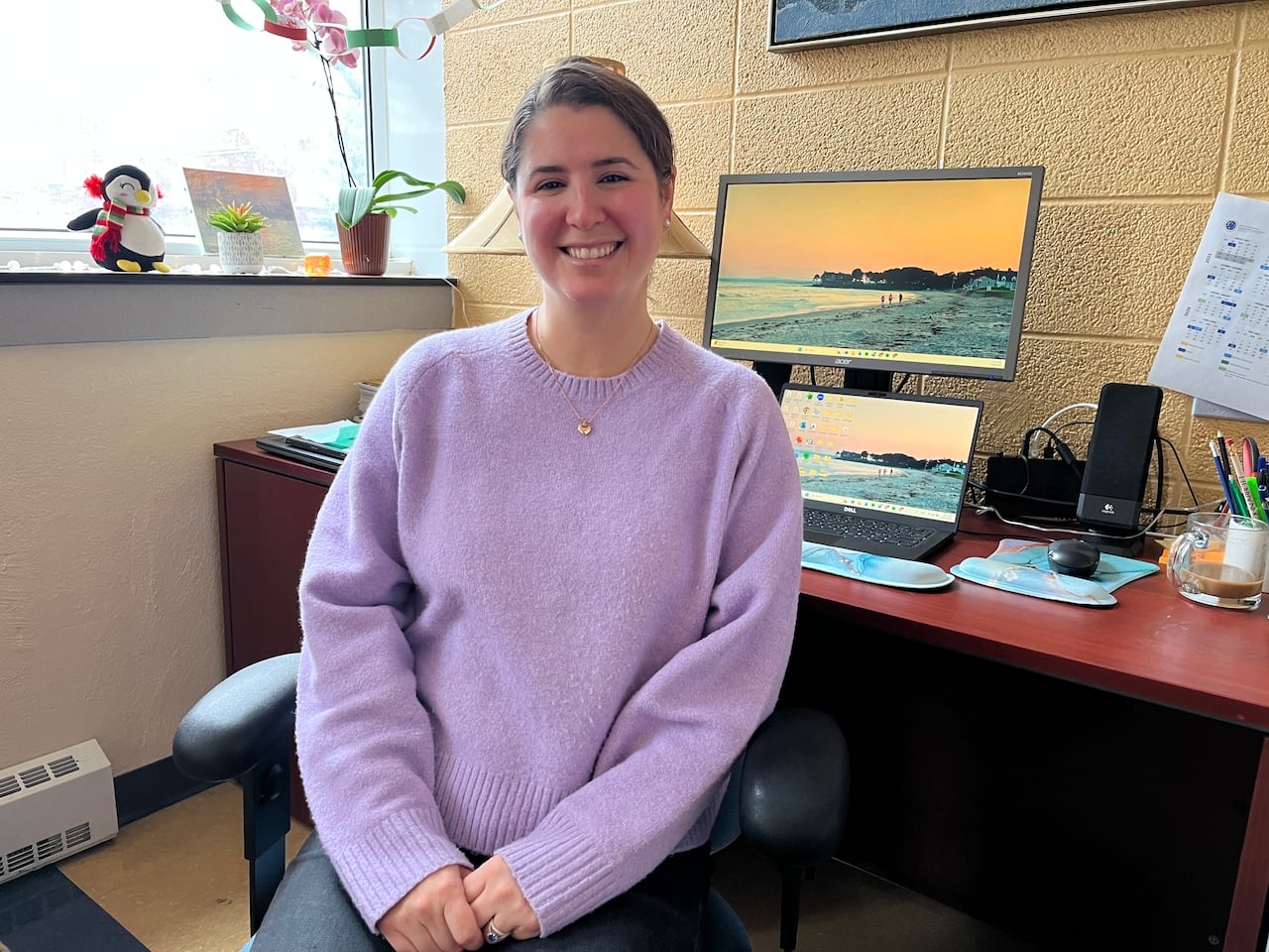 Woman sitting at her desk.