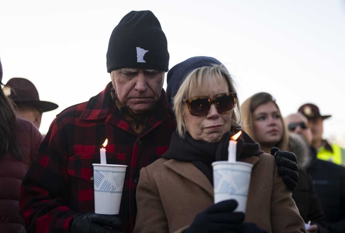 Minnesota Gov. Tim Walz and his wife Gwen Walz look on during a vigil for Renee Macklin Good on the steps of the state capitol building on January 9, 2026 in St. Paul, Minn.