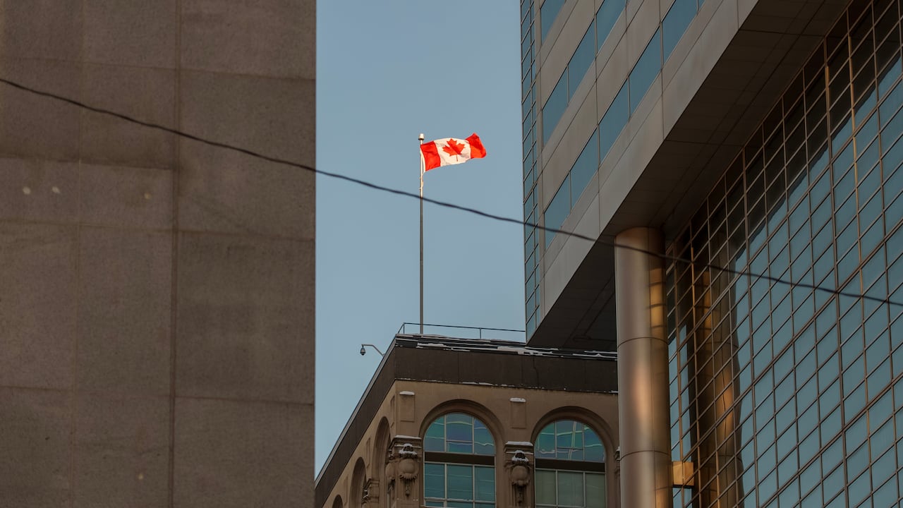 The Canadian flag flies over a downtown office building in Ottawa, just a few blocks south of Parliament Hill, in January 2026.