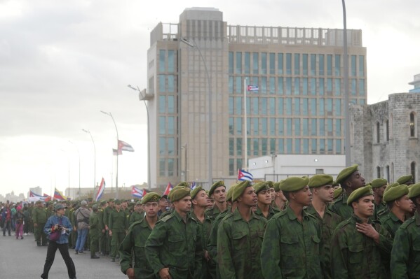 Soldiers march outside the U.S. Embassy during a rally to protest the killing of Cuban officers during the U.S. operation in Venezuela that captured Venezuelan President Nicolas Maduro in Havana, Cuba, Friday, Jan. 16, 2026. (AP Photo/Ramon Espinosa)