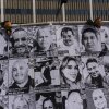 An art installation, which displays black and white images of people detained or deported as a result of ICE raids in Southern California, stands outside the federal building in Los Angeles, Thursday, July 17, 2025.