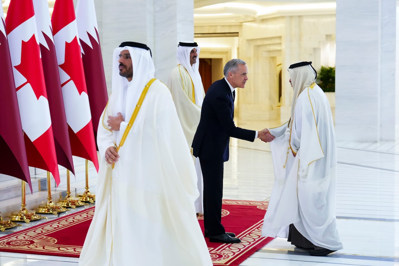 Prime Minister Mark Carney stands with Emir of Qatar Tamim bin Hamad al-Thani