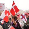 Protesters wave Greenlandic flags as they take part in a rally under the slogans 'hands off Greenland' and 'Greenland for Greenlanders,' in front of City Hall in Copenhagen, Denmark, on Saturday.