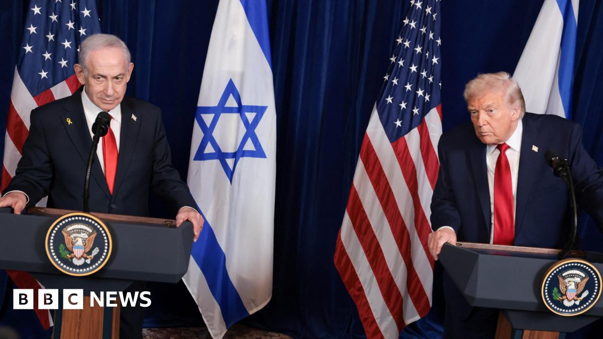 Trump and Netanyahu speaking at a conference, while both wearing suits with red ties with Israeli and US flags in background