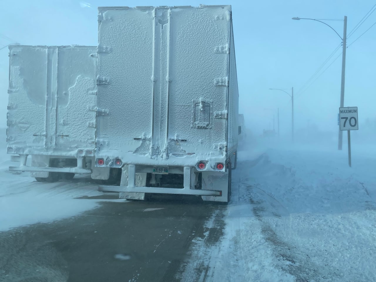 Highway closures lead to bottleneck of semi-trucks in Winnipeg amid snowy conditions