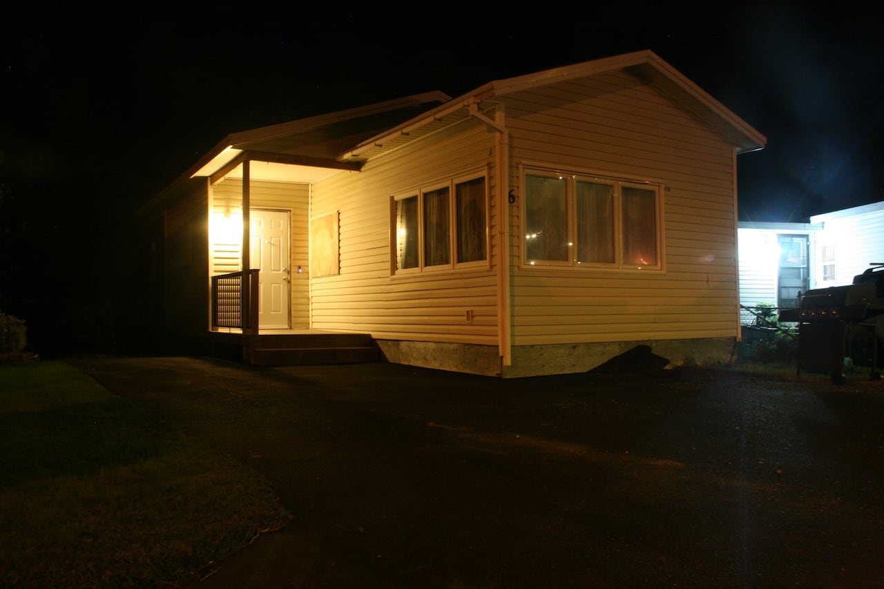 A mobile home at night.