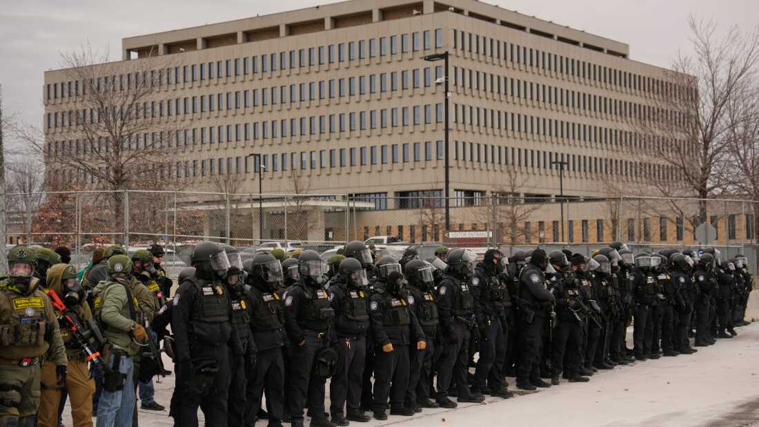 Federal immigration officers outside Bishop Henry Whipple Federal Building, Thursday in Minneapolis.