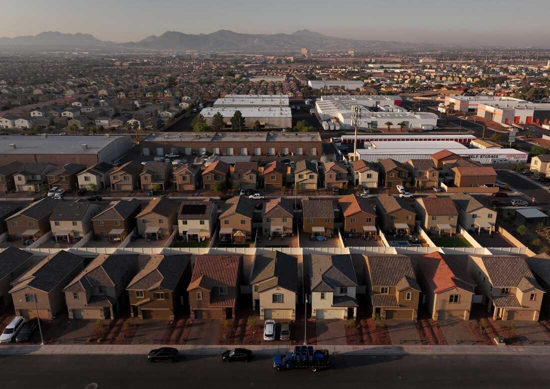 This aerial view shows a housing development in Las Vegas on August 8, 2025. The development consists of rows of closely spaced two-story houses.
